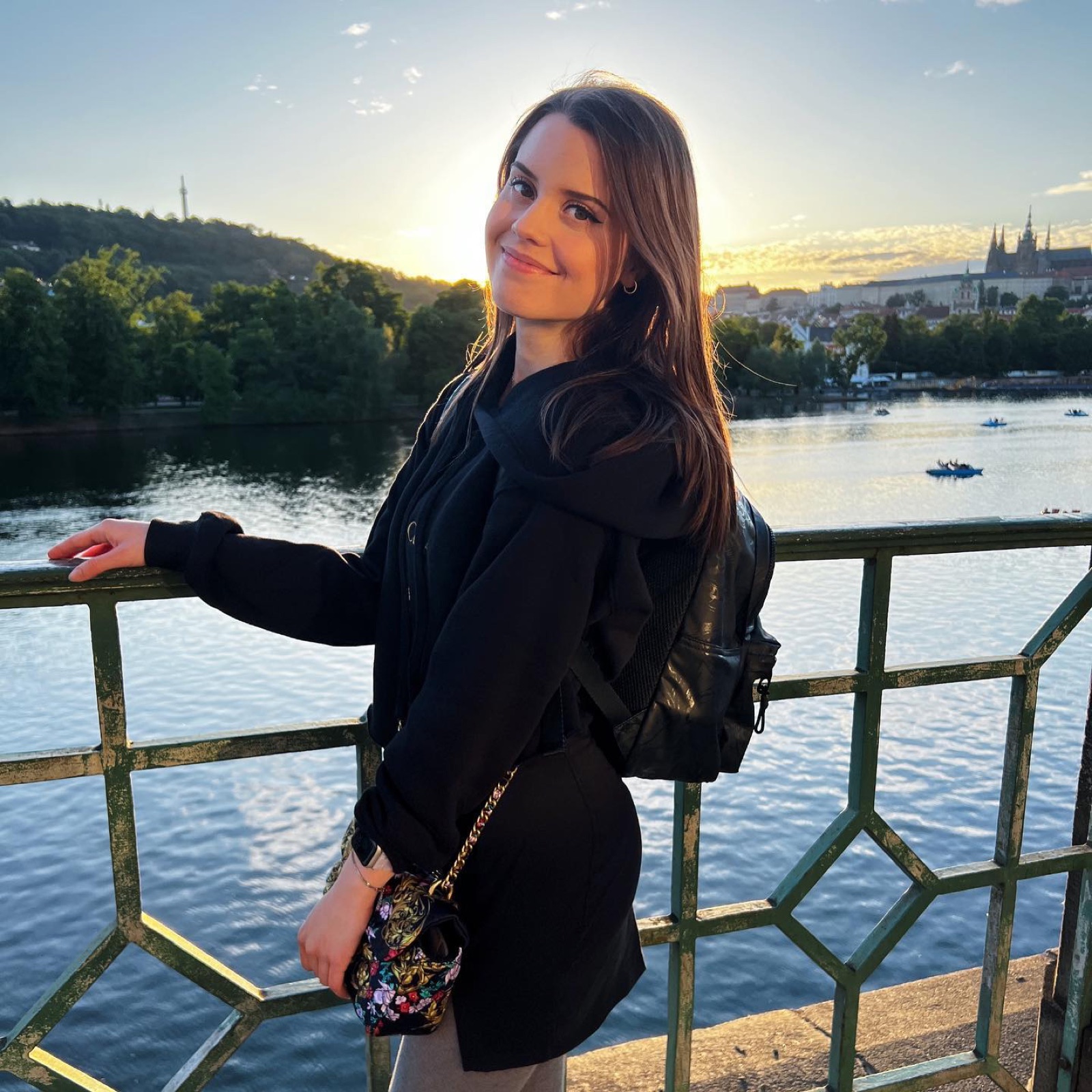 Jamie Young on a bridge in Prague at golden hour